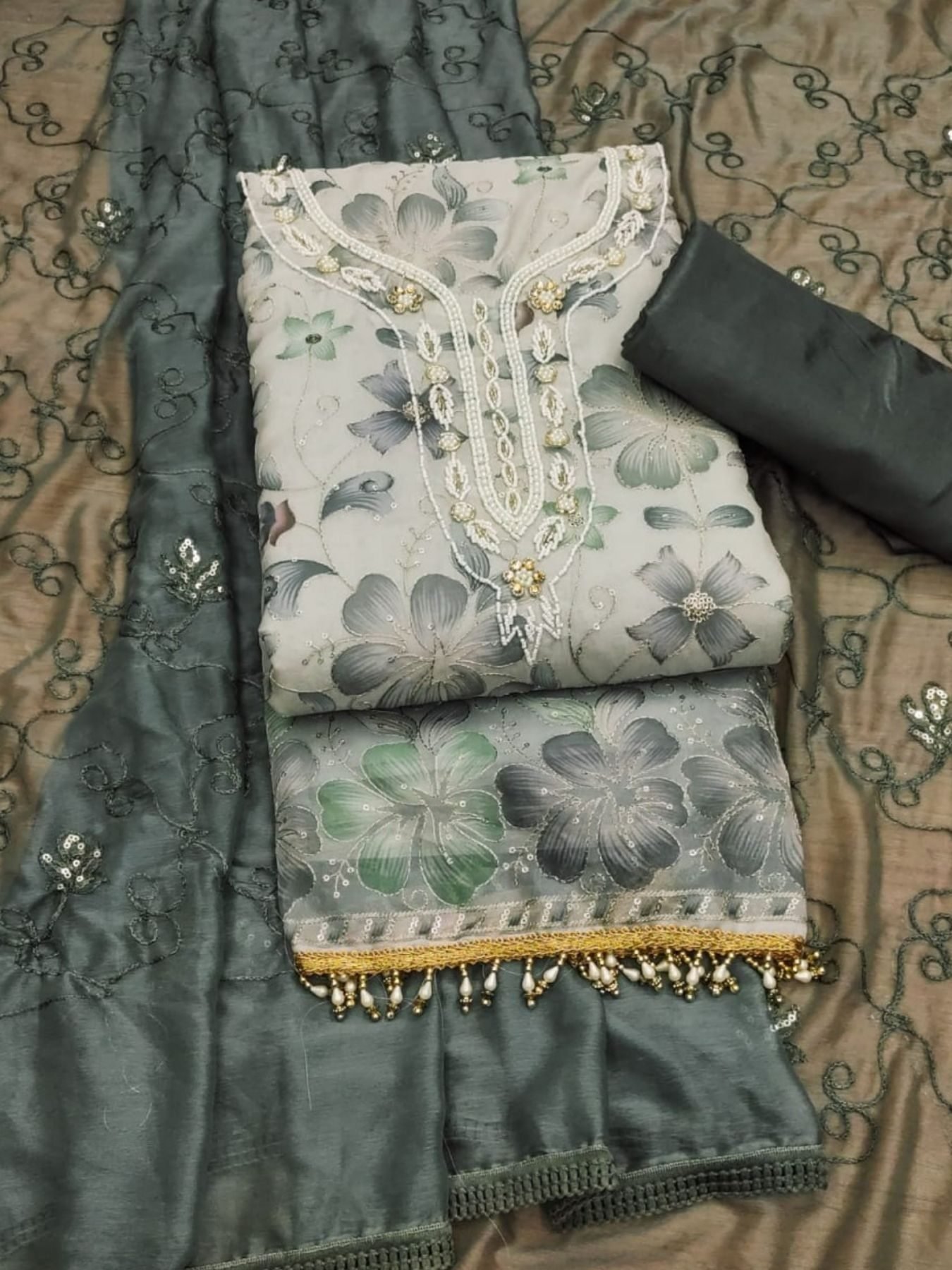 Elegance meets luxury in this exquisite ensemble. top is crafted from soft  organza, offering a delicate and graceful look.