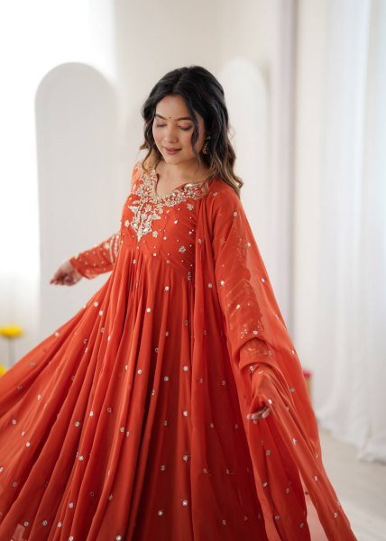 Alluring Orange Faux Georgette Gown with Heavy Embroidery Work For Diwali Festival Ready To Wear Collection