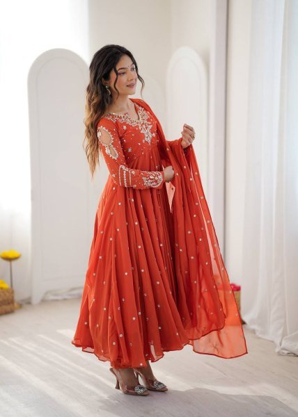 Alluring Orange Faux Georgette Gown with Heavy Embroidery Work For Diwali Festival Ready To Wear Collection