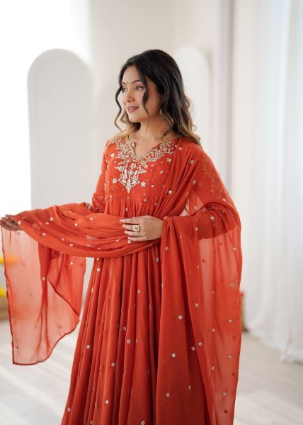 Alluring Orange Faux Georgette Gown with Heavy Embroidery Work For Diwali Festival Ready To Wear Collection