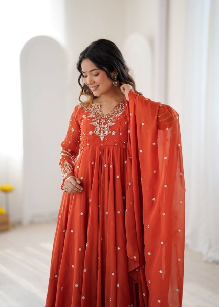 Alluring Orange Faux Georgette Gown with Heavy Embroidery Work For Diwali Festival Ready To Wear Collection
