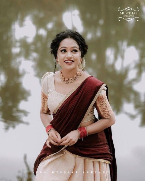 Bohemian Cream Onam Festival Jacquard Lehenga Choli with Chik Golden Patti Design Half Saree Lehenga