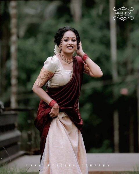 Bohemian Cream Onam Festival Jacquard Lehenga Choli with Chik Golden Patti Design Half Saree Lehenga
