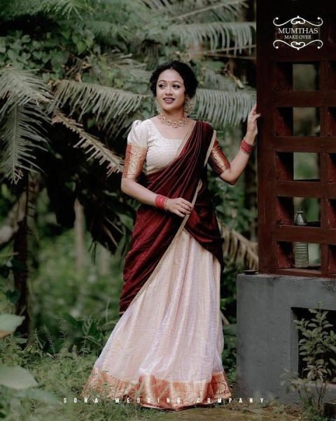 Bohemian Cream Onam Festival Jacquard Lehenga Choli with Chik Golden Patti Design Half Saree Lehenga
