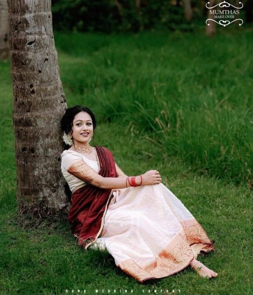 Bohemian Cream Onam Festival Jacquard Lehenga Choli with Chik Golden Patti Design Half Saree Lehenga