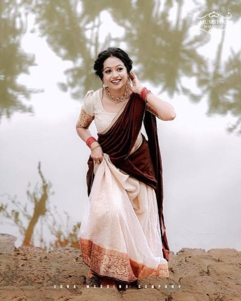 Bohemian Cream Onam Festival Jacquard Lehenga Choli with Chik Golden Patti Design Half Saree Lehenga