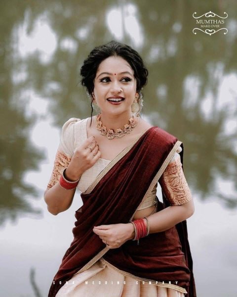 Bohemian Cream Onam Festival Jacquard Lehenga Choli with Chik Golden Patti Design Half Saree Lehenga