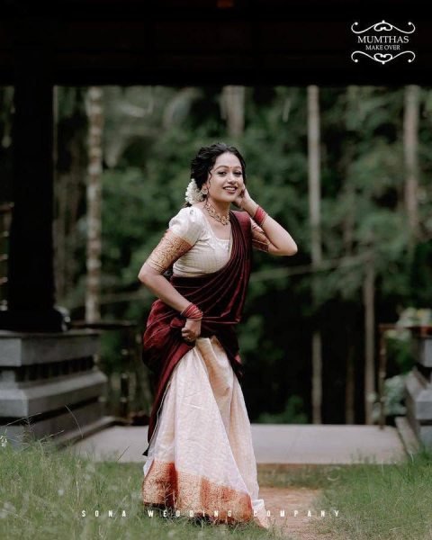 Bohemian Cream Onam Festival Jacquard Lehenga Choli with Chik Golden Patti Design Half Saree Lehenga