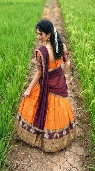 Charming Orange Gadhwal Silk Lehenga Choli with Zari Weaving and Embroidered Dupatta Half Saree Lehenga