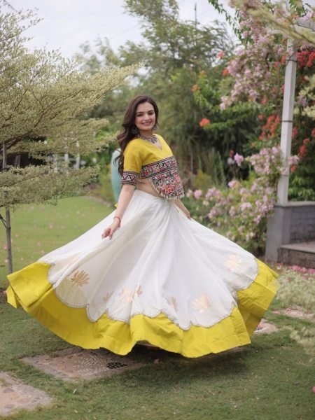 Ethereal White Yellow Roman Fabric Garba Lehenga Choli with Mirror Lace Design  Lehenga