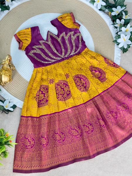 Festive Wear Yellow Girls Silk Pattu Pavadai with Contrast Lotus Motif Blouse Girls Wear
