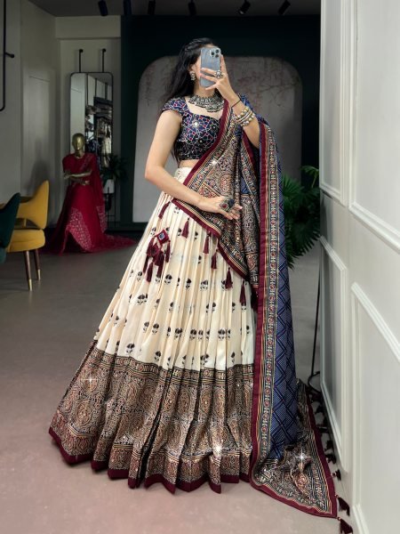 Glamorous Cream Tasar Silk Ajrak Print Lehenga with Mirror Work and Dupatta for Festival Navratri Lehnega Choli
