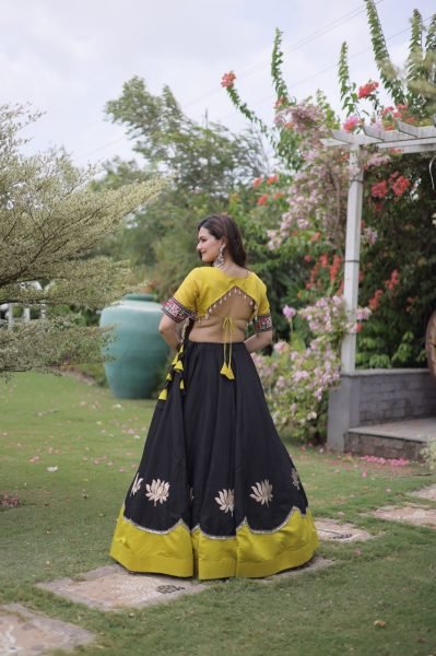 Graceful Black Yellow Roman Fabric Navratri Lehenga Choli with Kutchi Gamthi Work Navratri Lehnega Choli