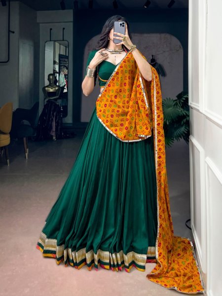 Graceful Dark Green Chinon Navratri Lehenga Choli with Bandhani Dupatta Navratri Lehnega Choli