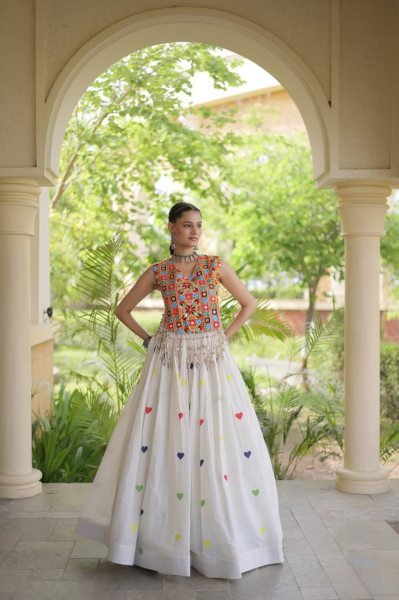 Iconic White Cotton Chaniya Choli with Sleeveless Gamthi Mirror Work Blouse Navratri Lehnega Choli