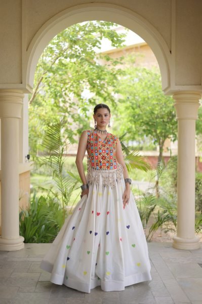 Iconic White Cotton Chaniya Choli with Sleeveless Gamthi Mirror Work Blouse Navratri Lehnega Choli