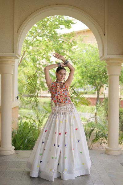 Iconic White Cotton Chaniya Choli with Sleeveless Gamthi Mirror Work Blouse Navratri Lehnega Choli