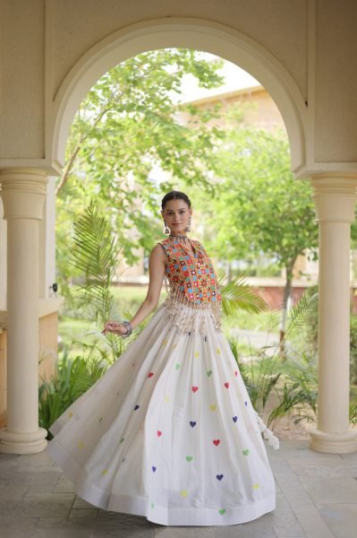 Iconic White Cotton Chaniya Choli with Sleeveless Gamthi Mirror Work Blouse Navratri Lehnega Choli