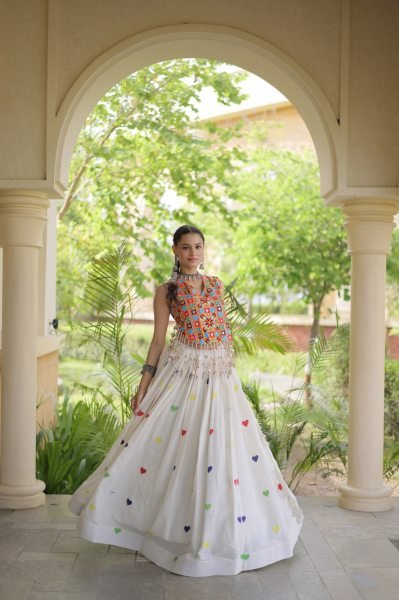 Iconic White Cotton Chaniya Choli with Sleeveless Gamthi Mirror Work Blouse Navratri Lehnega Choli
