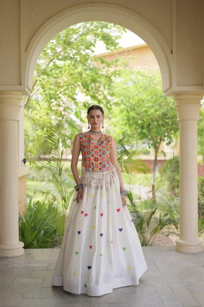 Iconic White Cotton Chaniya Choli with Sleeveless Gamthi Mirror Work Blouse Navratri Lehnega Choli