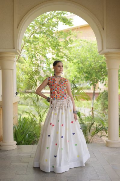 Iconic White Cotton Chaniya Choli with Sleeveless Gamthi Mirror Work Blouse Navratri Lehnega Choli