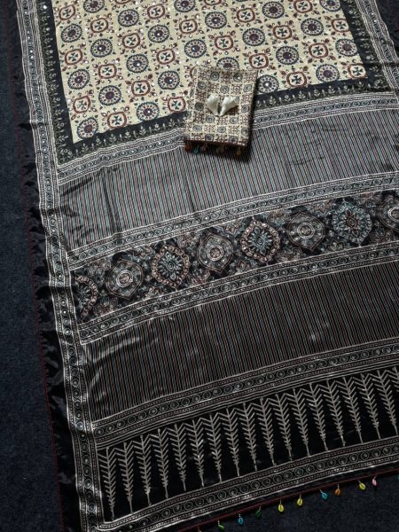 Impressive Cream Black Ajrakh Print Roman Silk Saree with Mirror Work for Festive Wear  Silk Sarees Wholesale
