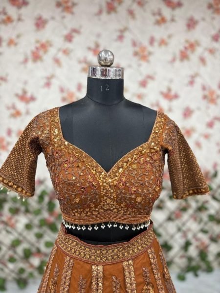 Ingenious Brown Butterfly Net Lehenga Choli with Heavy Glass Sequins Work at Wholesale Rate Designer Lehenga Choli