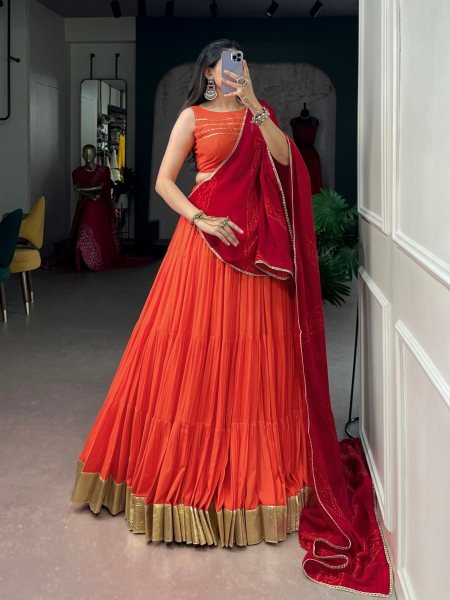 Mesmerizing Orange Rayon Lehenga Choli with Embossed Lace Work and Dupatta For Navratri Navratri Lehnega Choli