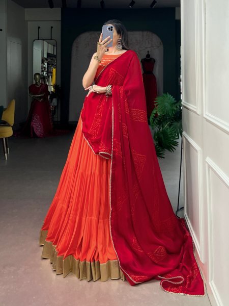 Mesmerizing Orange Rayon Lehenga Choli with Embossed Lace Work and Dupatta For Navratri Navratri Lehnega Choli