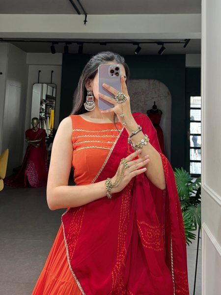 Mesmerizing Orange Rayon Lehenga Choli with Embossed Lace Work and Dupatta For Navratri Navratri Lehnega Choli