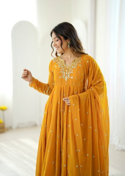 Mesmerizing Yellow Faux Georgette Gown Pant Dupatta Set with 7 Meter Flair for Reseller Ready To Wear Collection