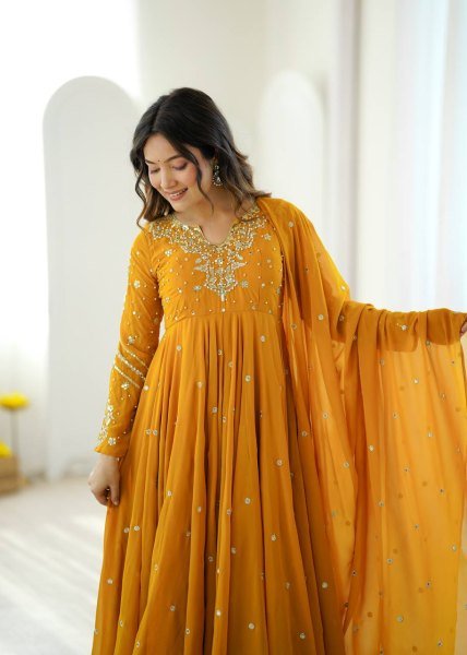 Mesmerizing Yellow Faux Georgette Gown Pant Dupatta Set with 7 Meter Flair for Reseller Ready To Wear Collection