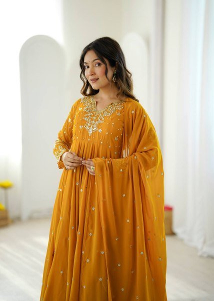 Mesmerizing Yellow Faux Georgette Gown Pant Dupatta Set with 7 Meter Flair for Reseller Ready To Wear Collection