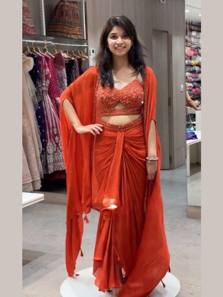 Festive Orange Dhoti Set with Designer Shrug Perfect for Wedding Guests