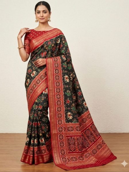 Patola silk saree traditional Ikat designs and a red zari border   Patola Silk Sarees Wholesale