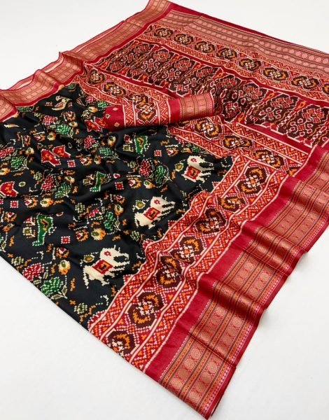 Patola silk saree traditional Ikat designs and a red zari border   Patola Silk Sarees Wholesale