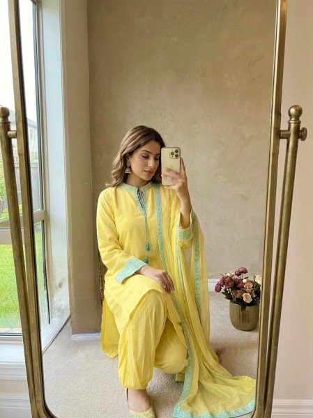 Sophisticated Yellow Crepe Silk Embroidered Top with Belly Sleeves Tassels Balloon Pants With Dupatta Ready To Wear Collection