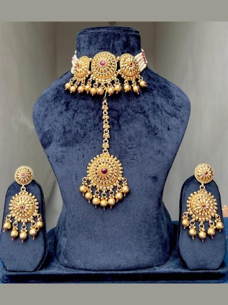 Unparalleled Gold Plated Matte Necklace Set with Earrings and Maang Tikka 