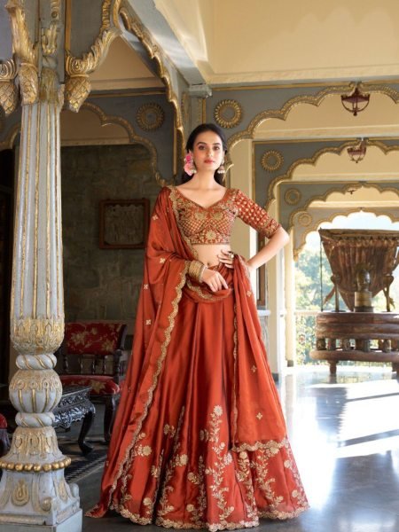 Upscale Rust Orange Rangoli Silk Lehenga Choli With Gold Thread And Sequin Embroidery  Lehenga