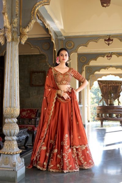 Upscale Rust Orange Rangoli Silk Lehenga Choli With Gold Thread And Sequin Embroidery Designer Lehenga Choli