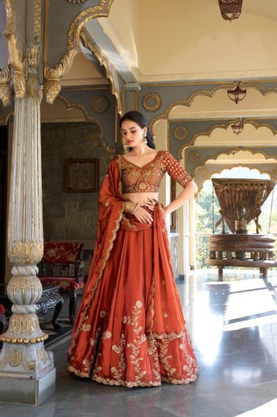 Upscale Rust Orange Rangoli Silk Lehenga Choli With Gold Thread And Sequin Embroidery Designer Lehenga Choli