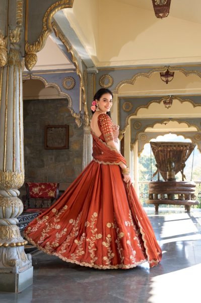 Upscale Rust Orange Rangoli Silk Lehenga Choli With Gold Thread And Sequin Embroidery Designer Lehenga Choli
