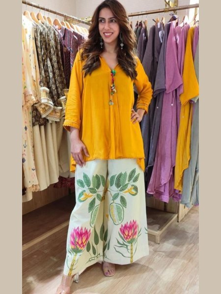 Woman Wearing  Yellow Top Paired With Wide-Leg Pants For Special Occasions  Kurtis